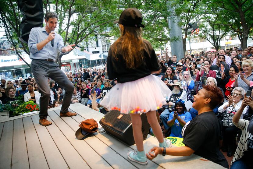 Democratic Presidential candidate Beto O'Rourke responds to a question from a young girl...