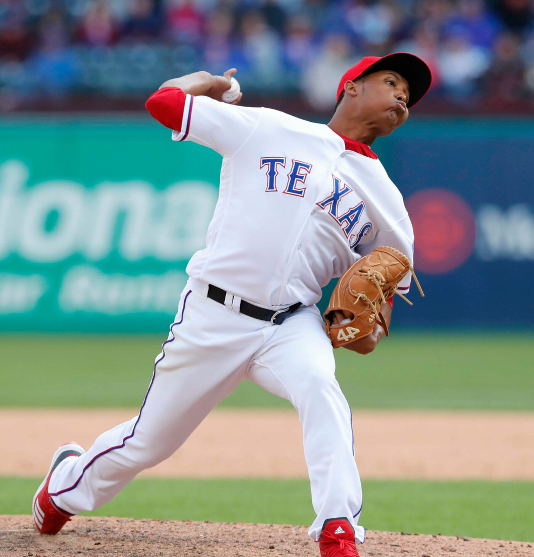 Texas Rangers relief pitcher Jose Leclerc throws during the ninth inning of a baseball game...