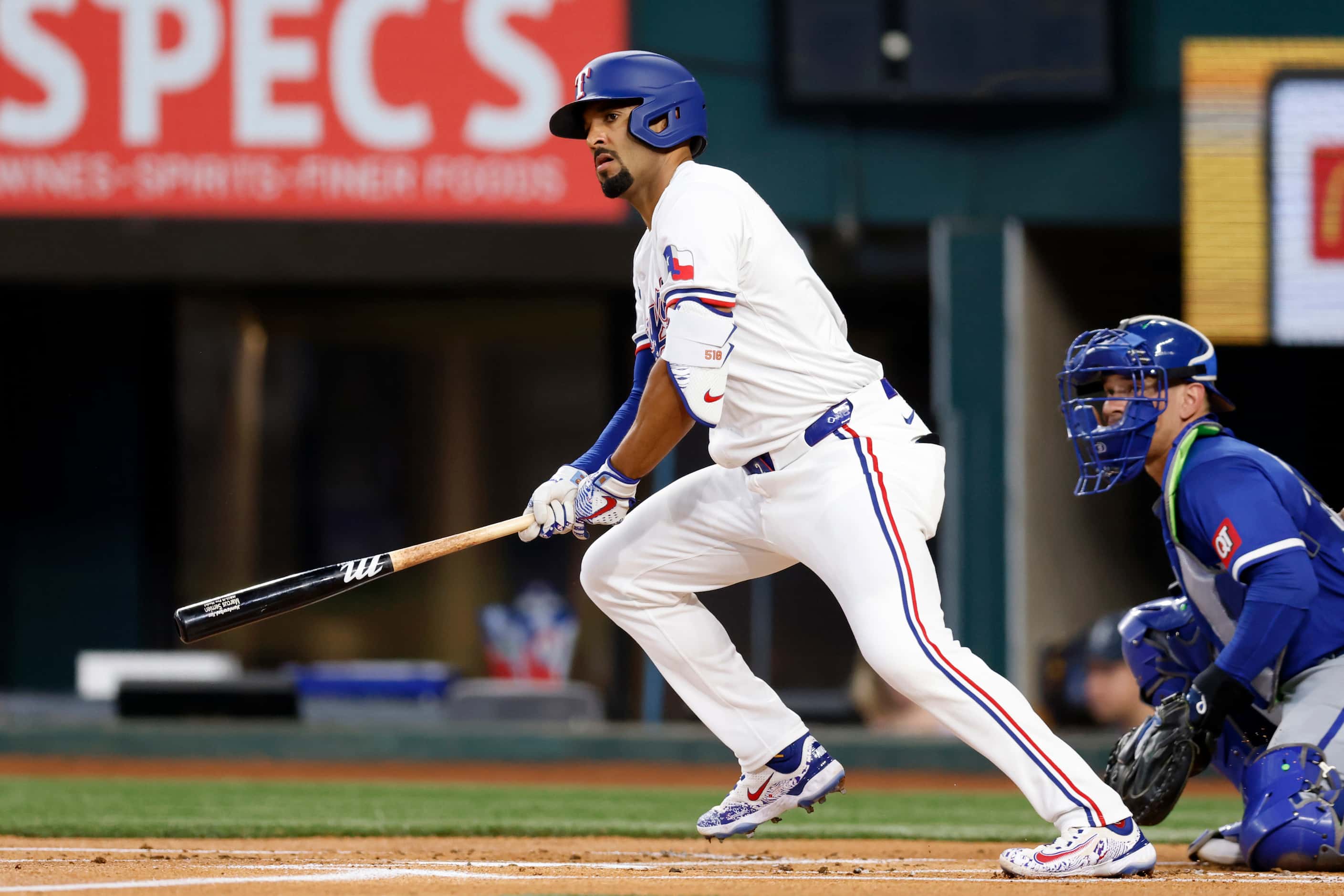 Texas Rangers second baseman Marcus Semien (2) watches the ball after making contact during...