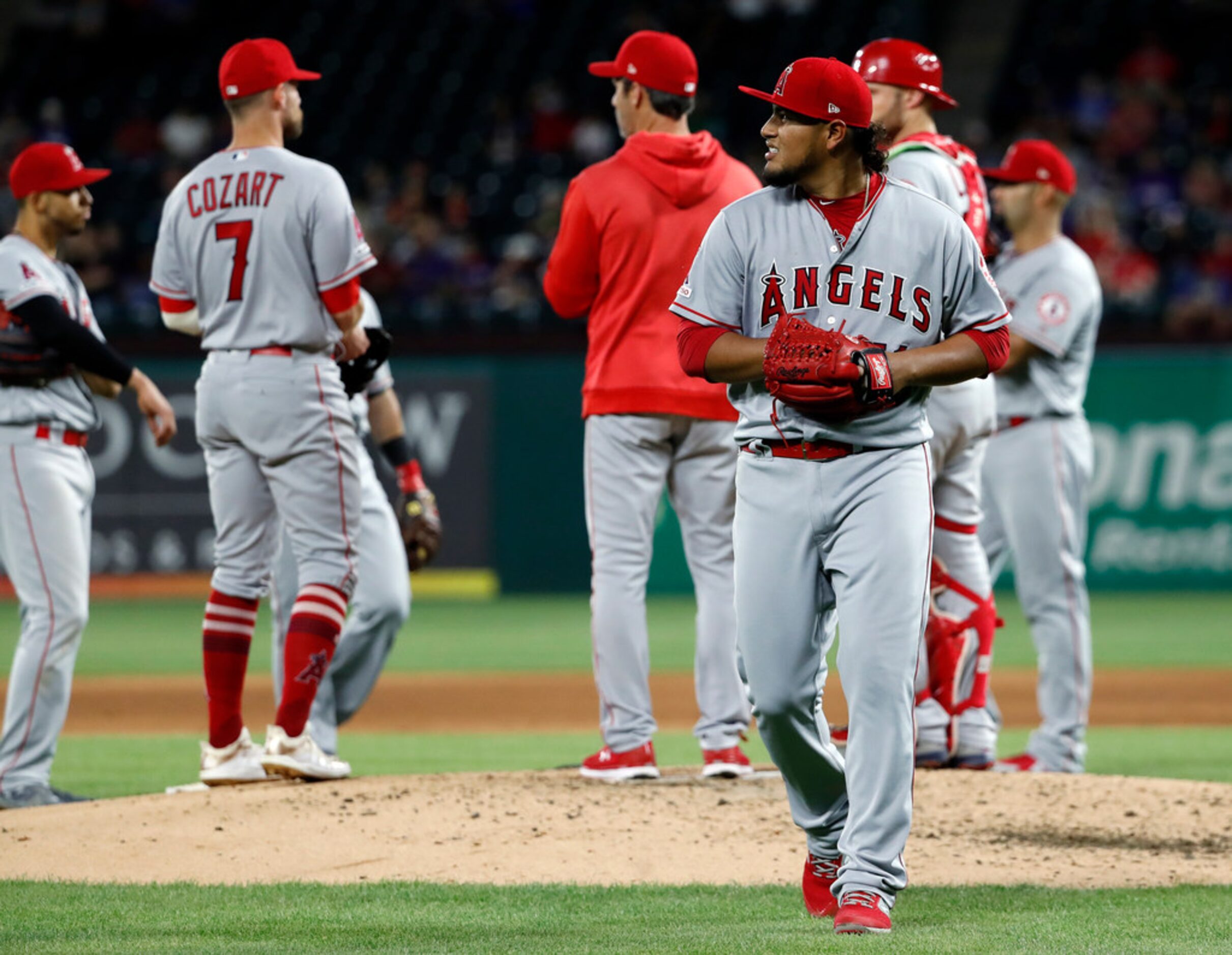 Los Angeles Angels starting pitcher Jaime Barria walks to the dugout after turning the ball...