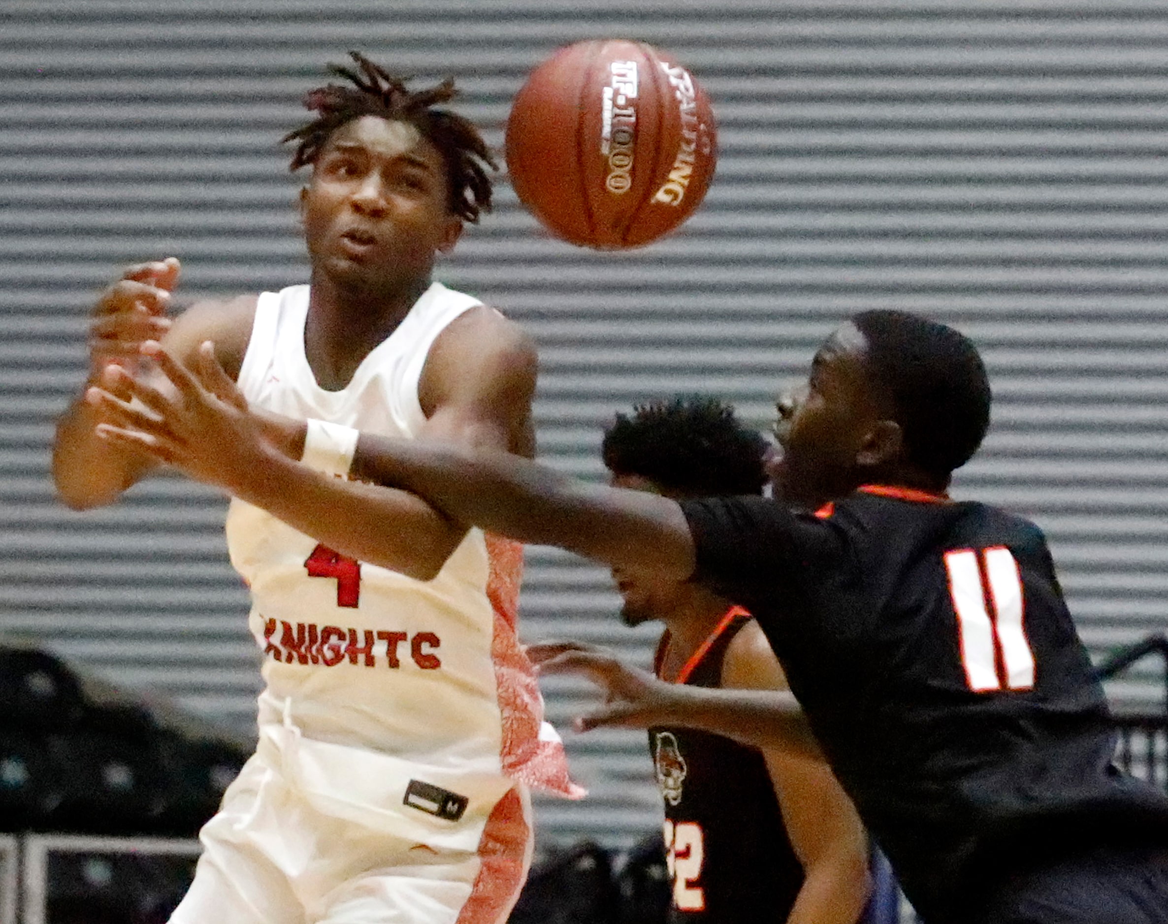 Kimball High School guard Arterio Morris (4) looses the bar as Lancaster High School guard...