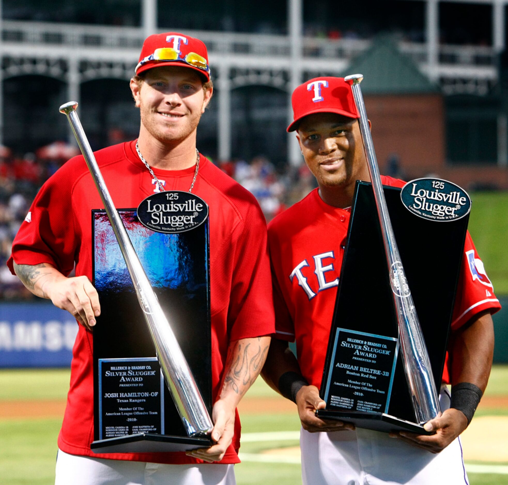 Texas Rangers players Josh Hamilton, left, and Adrian Beltre pose with the Silver Slugger...