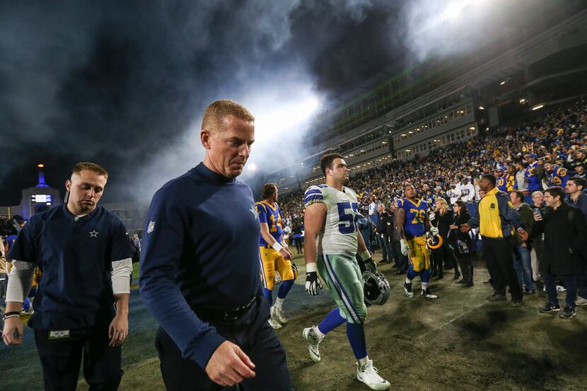 Dallas Cowboys head coach Jason Garrett exits the field following the Cowboys' 30-22 to the...