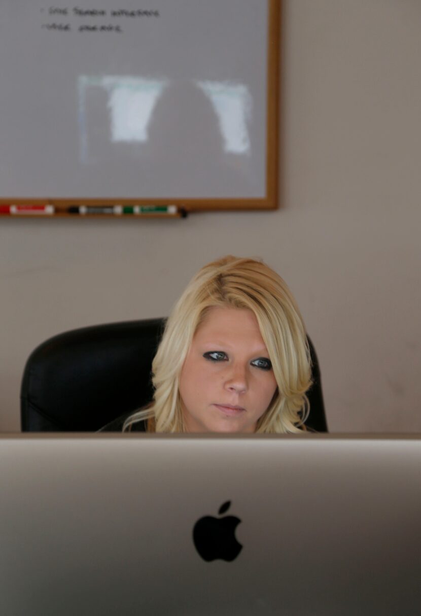 Brainspace developer Markie Arnold looks over code at their office in Dallas on April 28,...