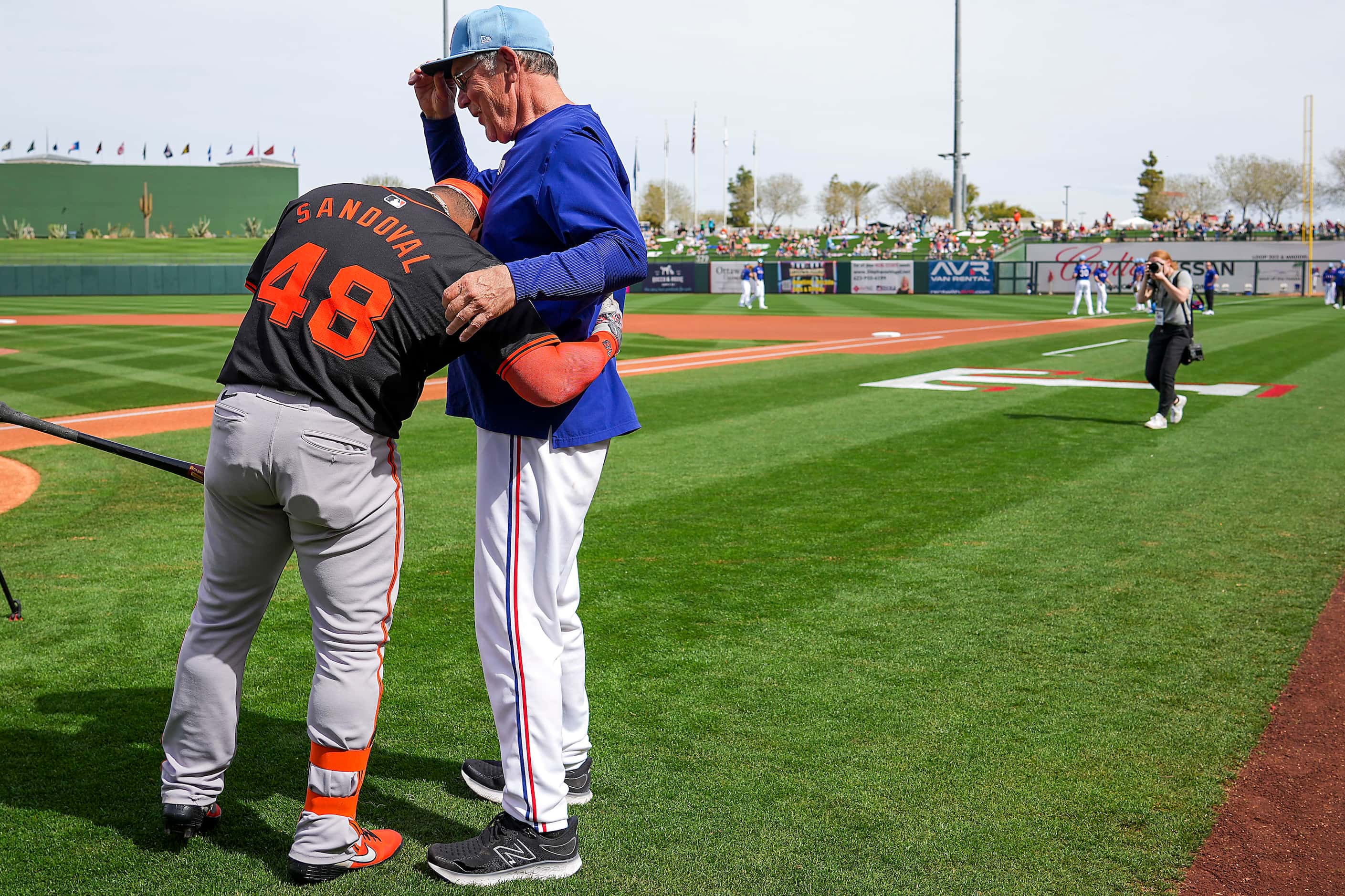 San Francisco Giants designated hitter Pablo Sandoval hugs Texas Rangers manager Bruce Bochy...