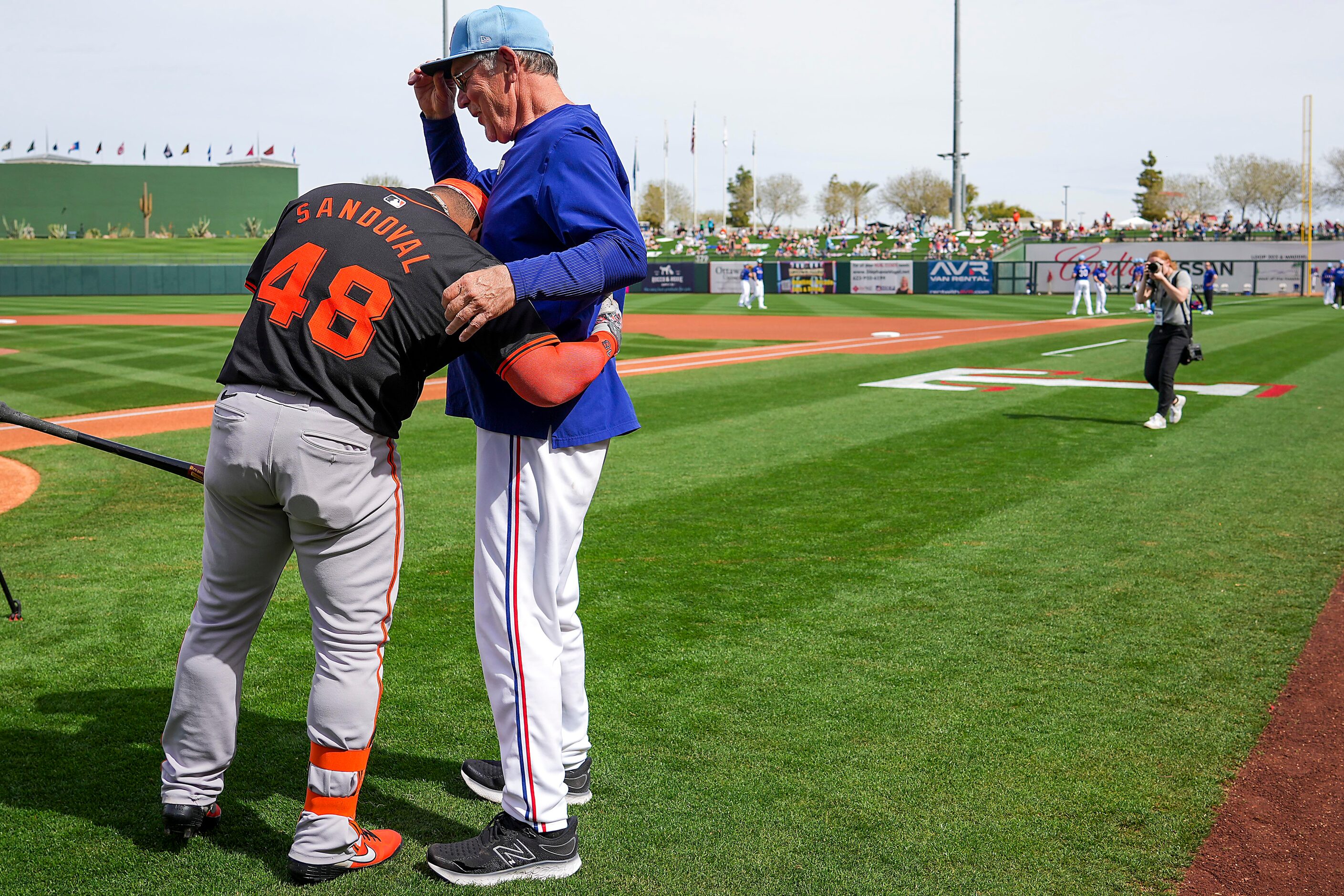 San Francisco Giants designated hitter Pablo Sandoval hugs Texas Rangers manager Bruce Bochy...