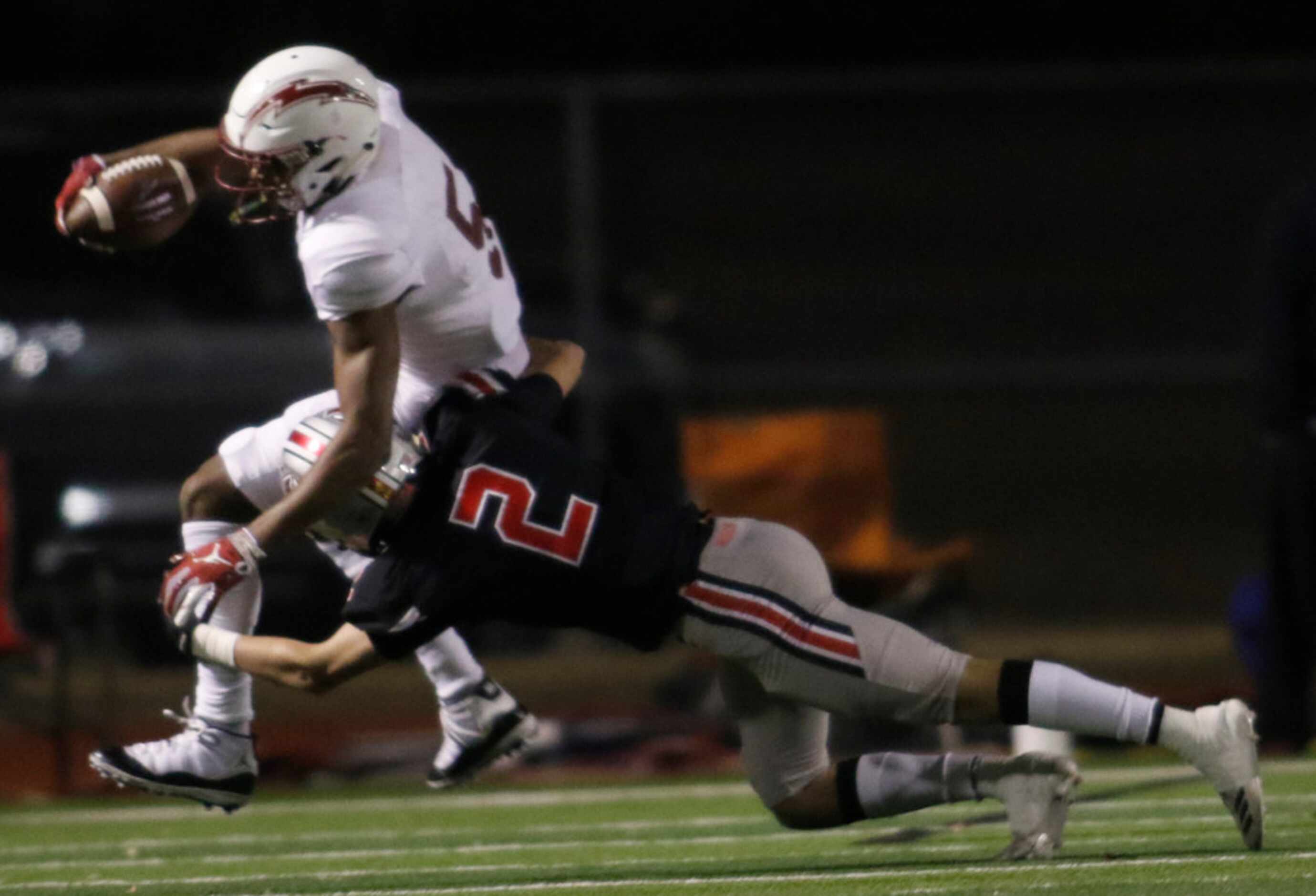 Keller Central receiver D.J. Graham (5) is unable to elude the defensive pursuit of Flower...