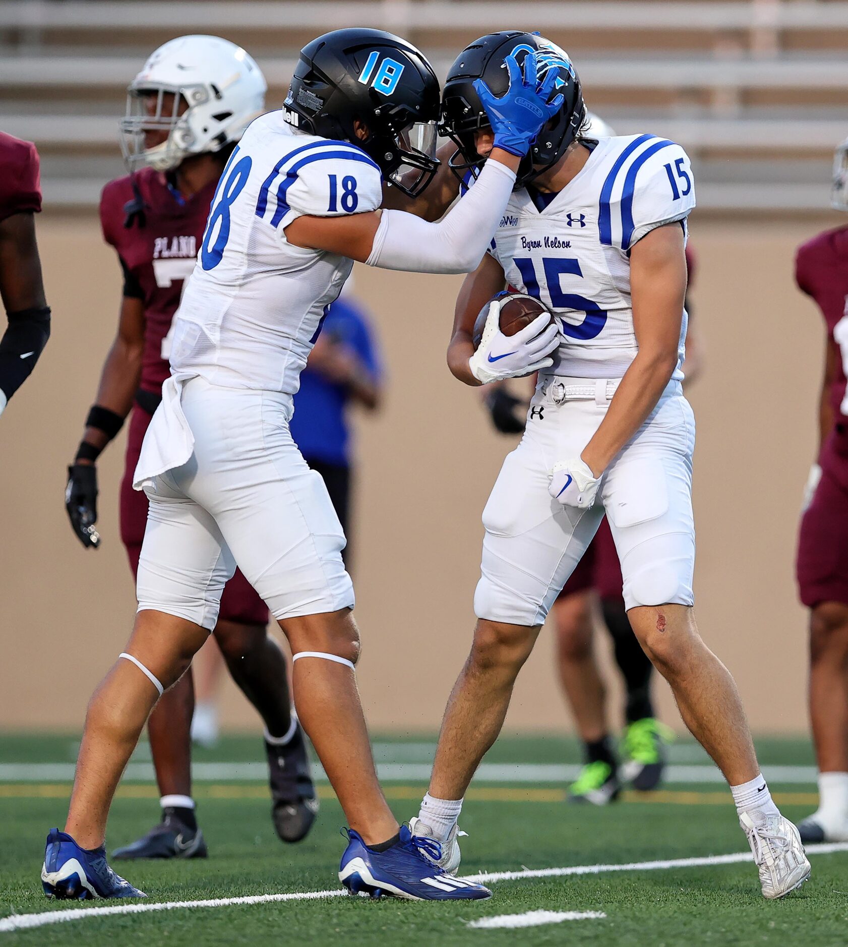 Byron Nelson wide receiver Grant Bizjack (15) celebrates with Ezra Malamura (18) after a...