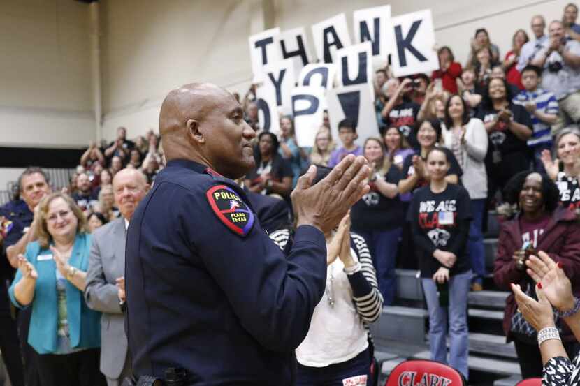  Plano police Officer Art Parker acknowledges people who honored him at Clark High School...