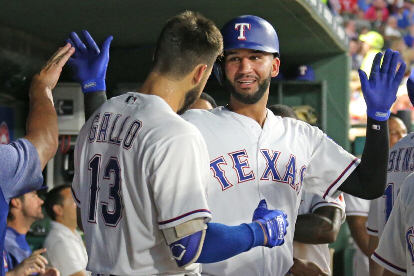 Texas Rangers Nomar Mazara, right, and Joey Gallo, left, are pictured in the dugout during...