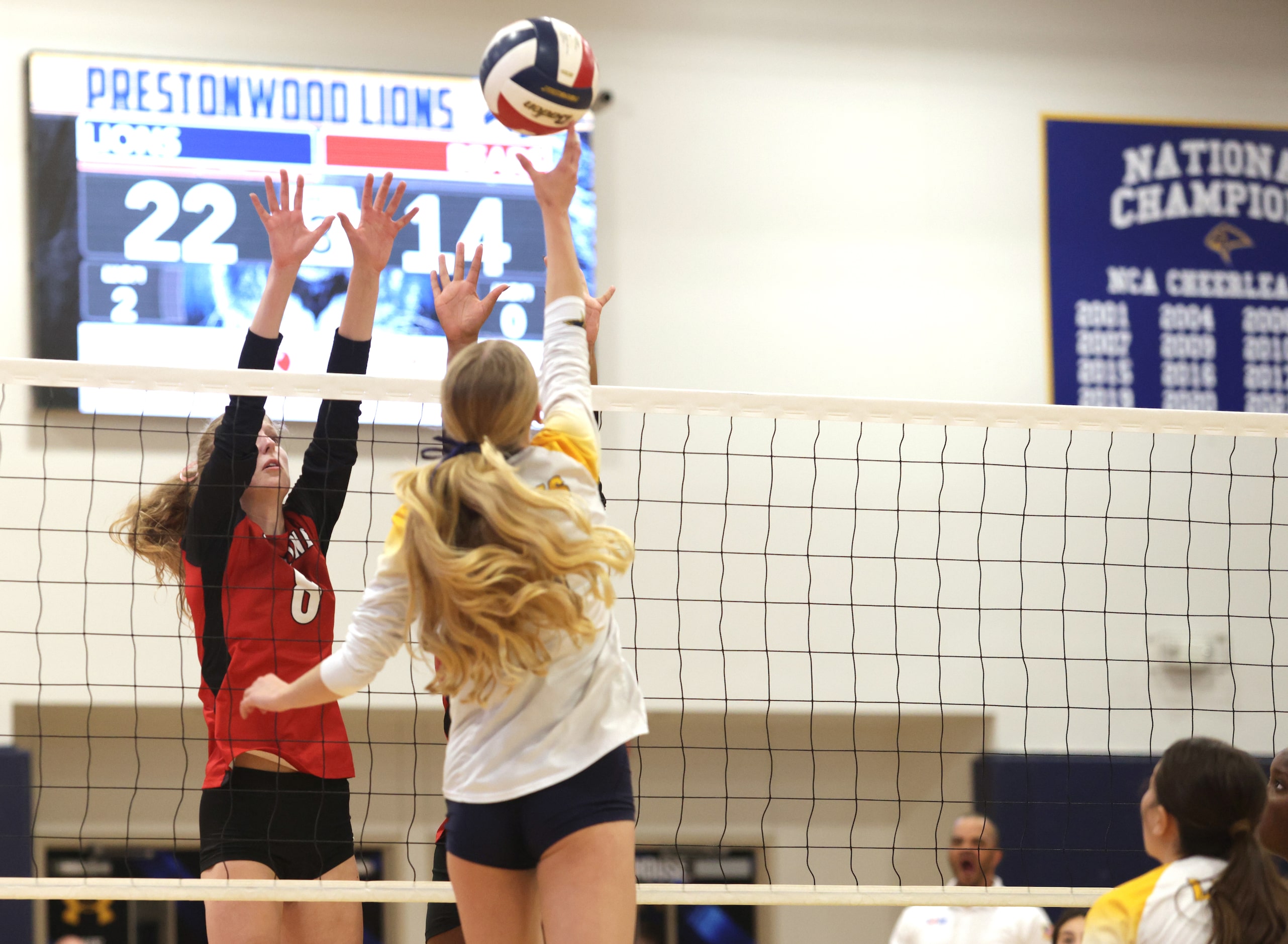 Ursuline player #8 Katie Rakoski tries to block Prestonwood player #1 Anya Baklenko the ball...