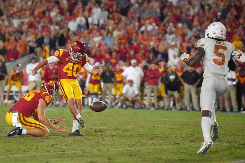Southern California's Chase McGrath (40) kicks the game-winning field goal from the hold of...