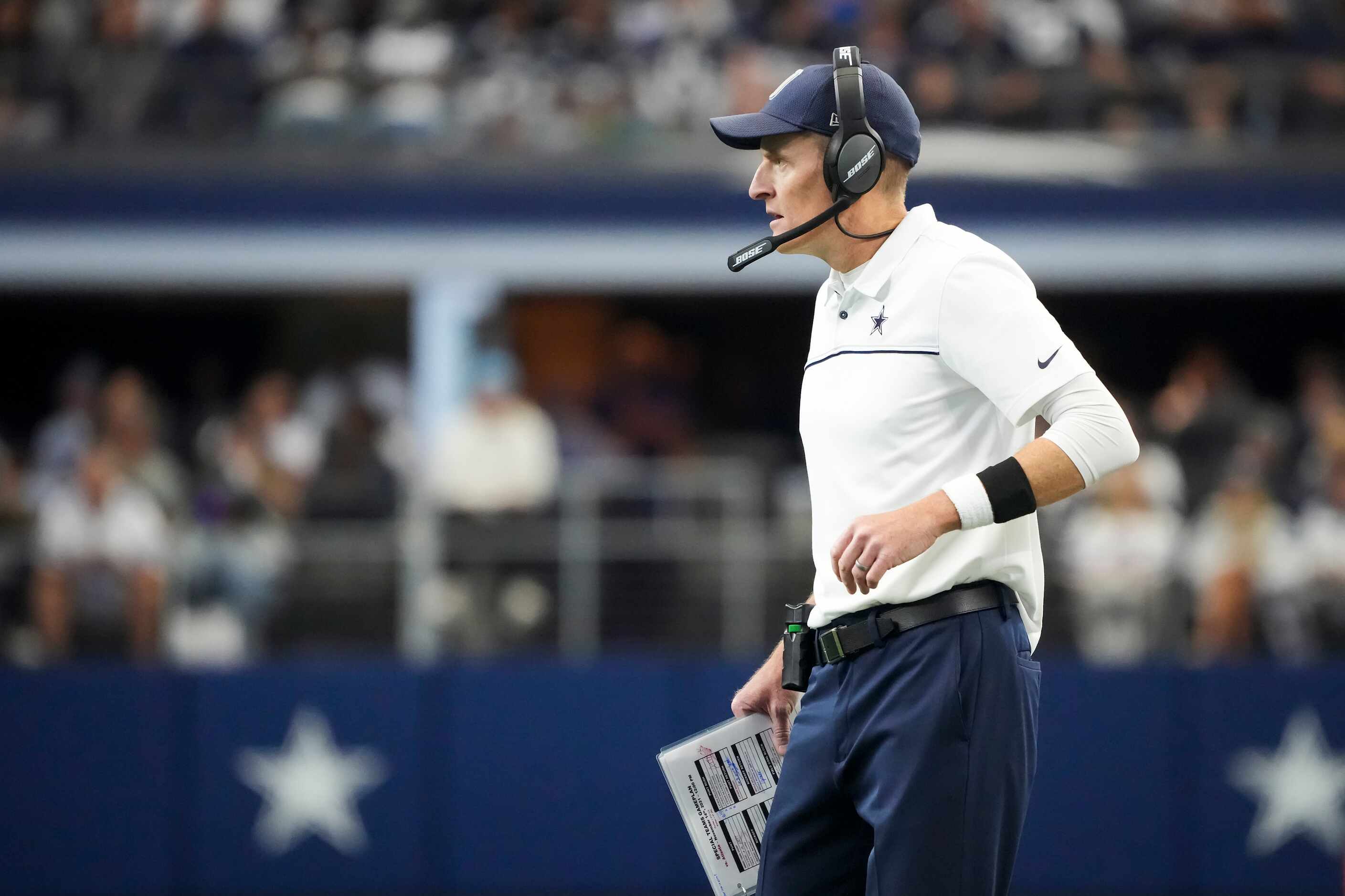 Dallas Cowboys special teams coordinator John Fassel works on the sidelines during the first...