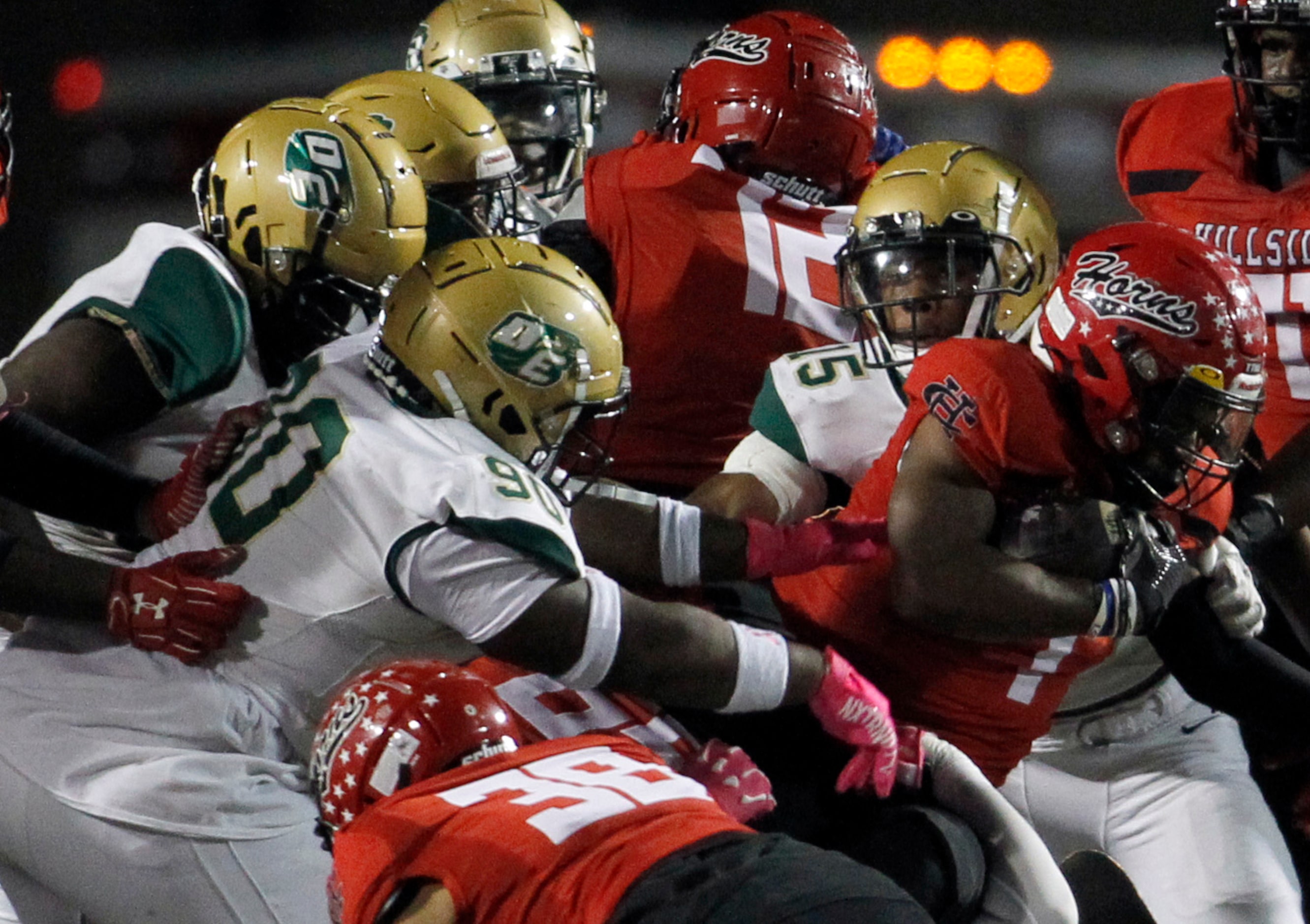 Cedar Hill running back Dayshun Reese-Williams (7), right, ran into a wall of DeSoto...