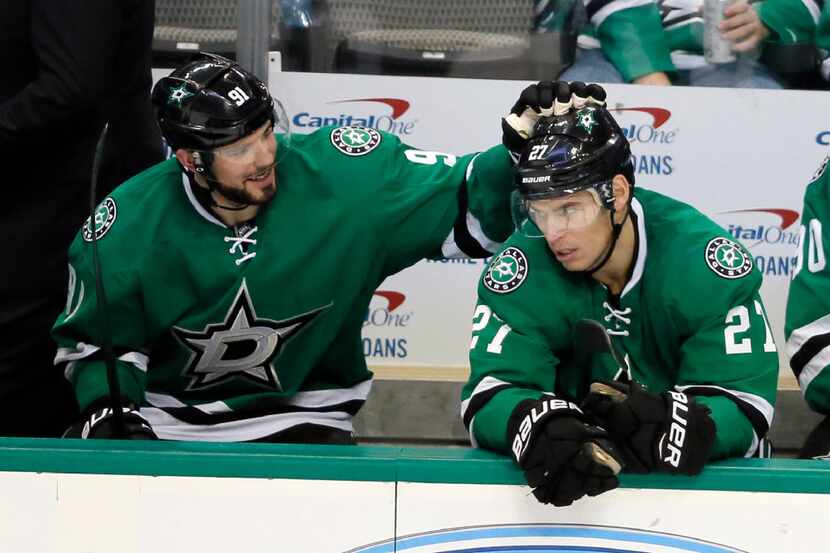 Dallas Stars' Tyler Seguin (91) gives right wing Adam Cracknell (27) a tap on the head as...