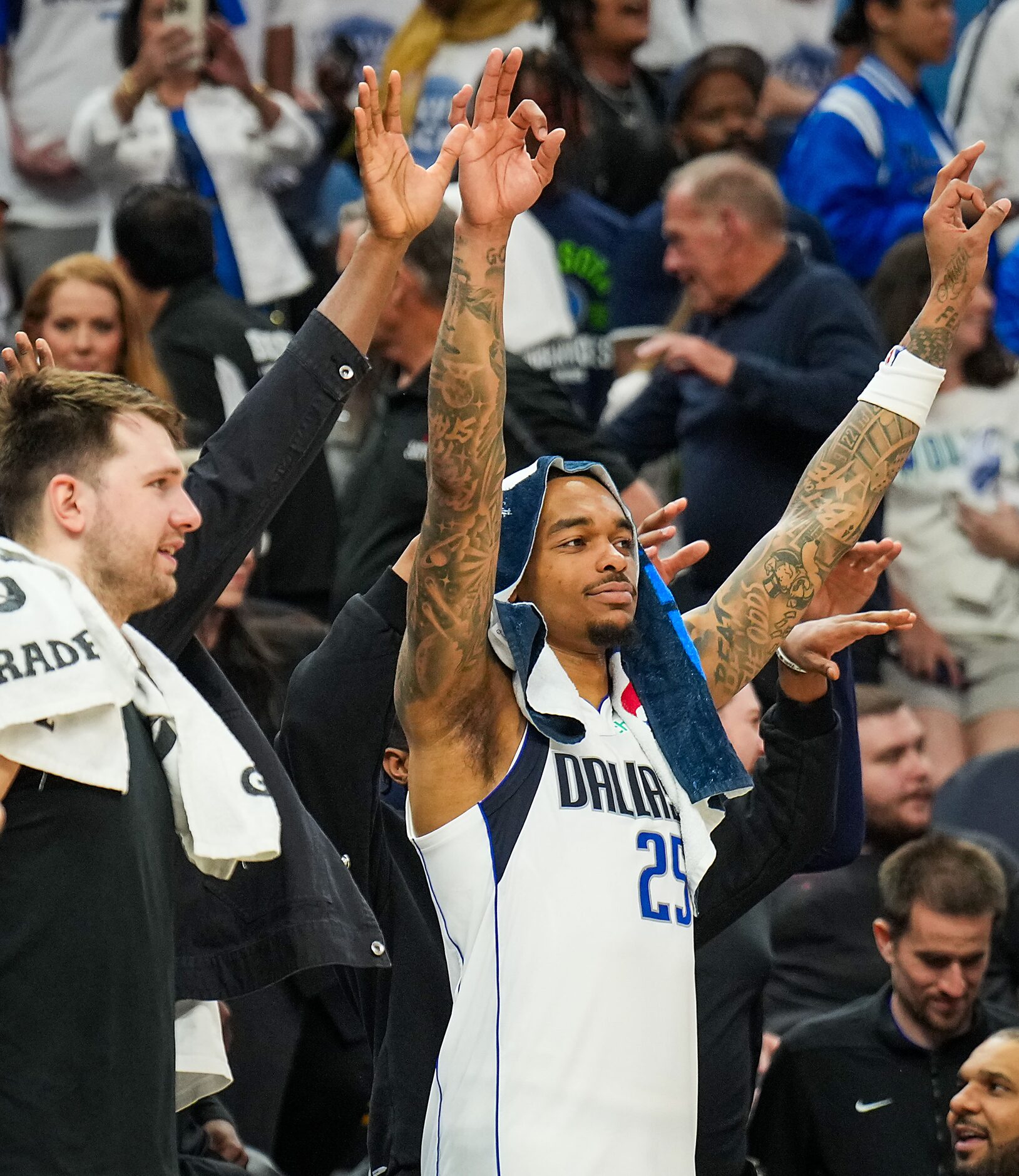 Dallas Mavericks guard Luka Doncic (left) and forward P.J. Washington (25) celebrate in the...