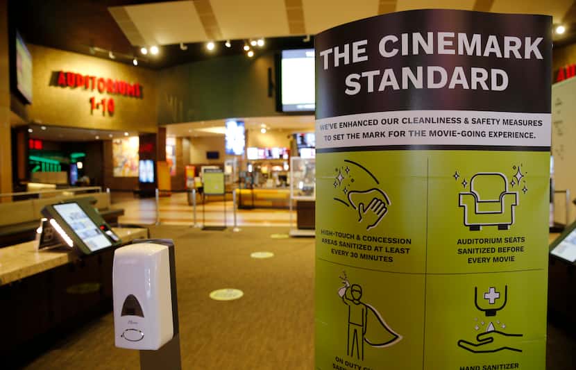 Signage noting new cleanliness and safety measures at Cinemark West in Plano, on Thursday....