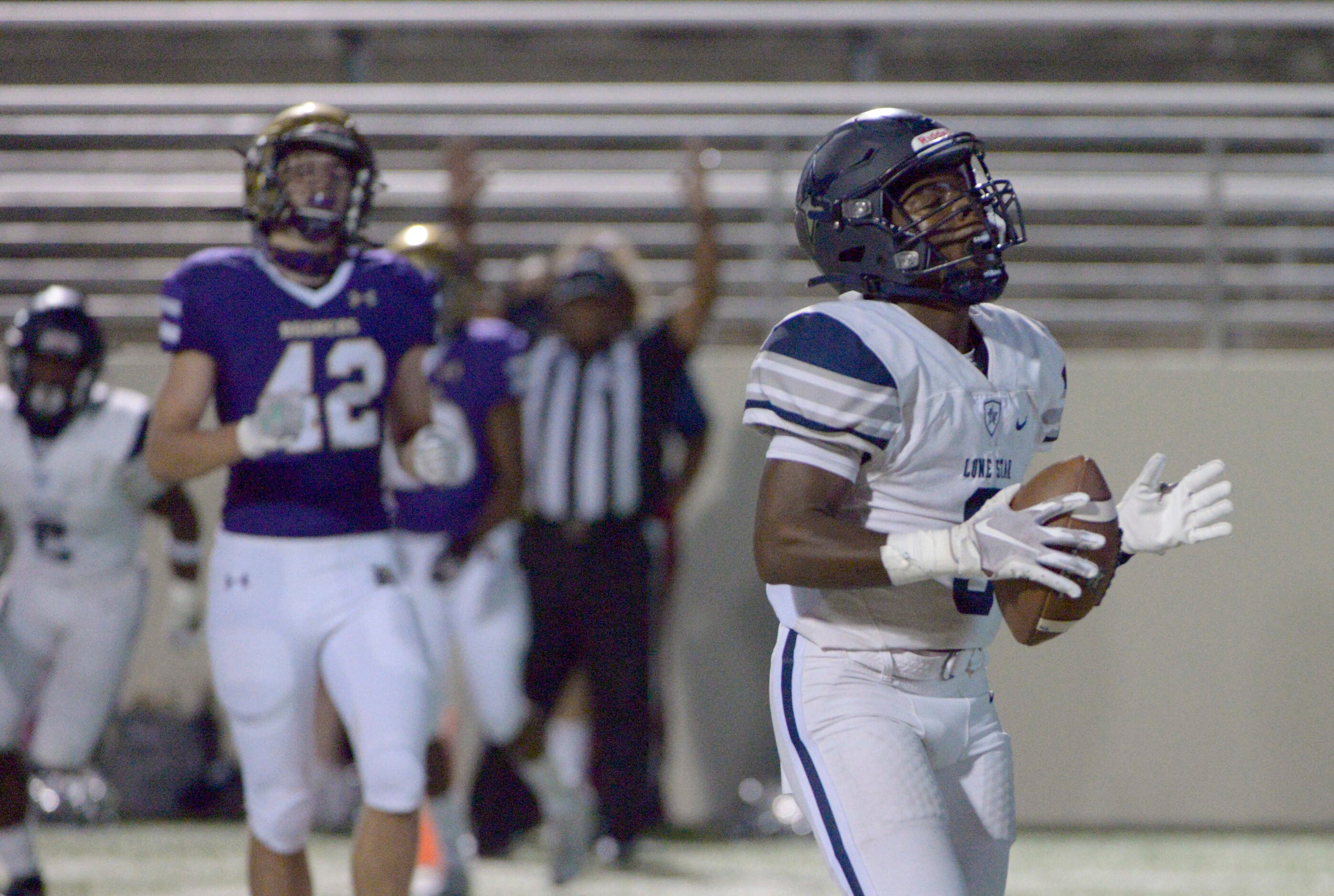 Lone Star’s Tolu Sokoya (3) reacts after his touchdown catch in the first quarter of a high...