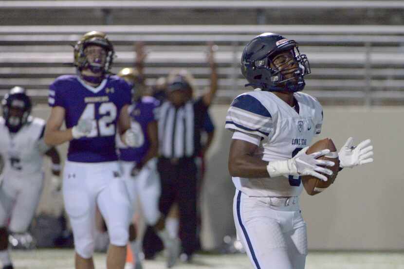 Lone Star’s Tolu Sokoya (3) reacts after his touchdown catch in the first quarter of a high...