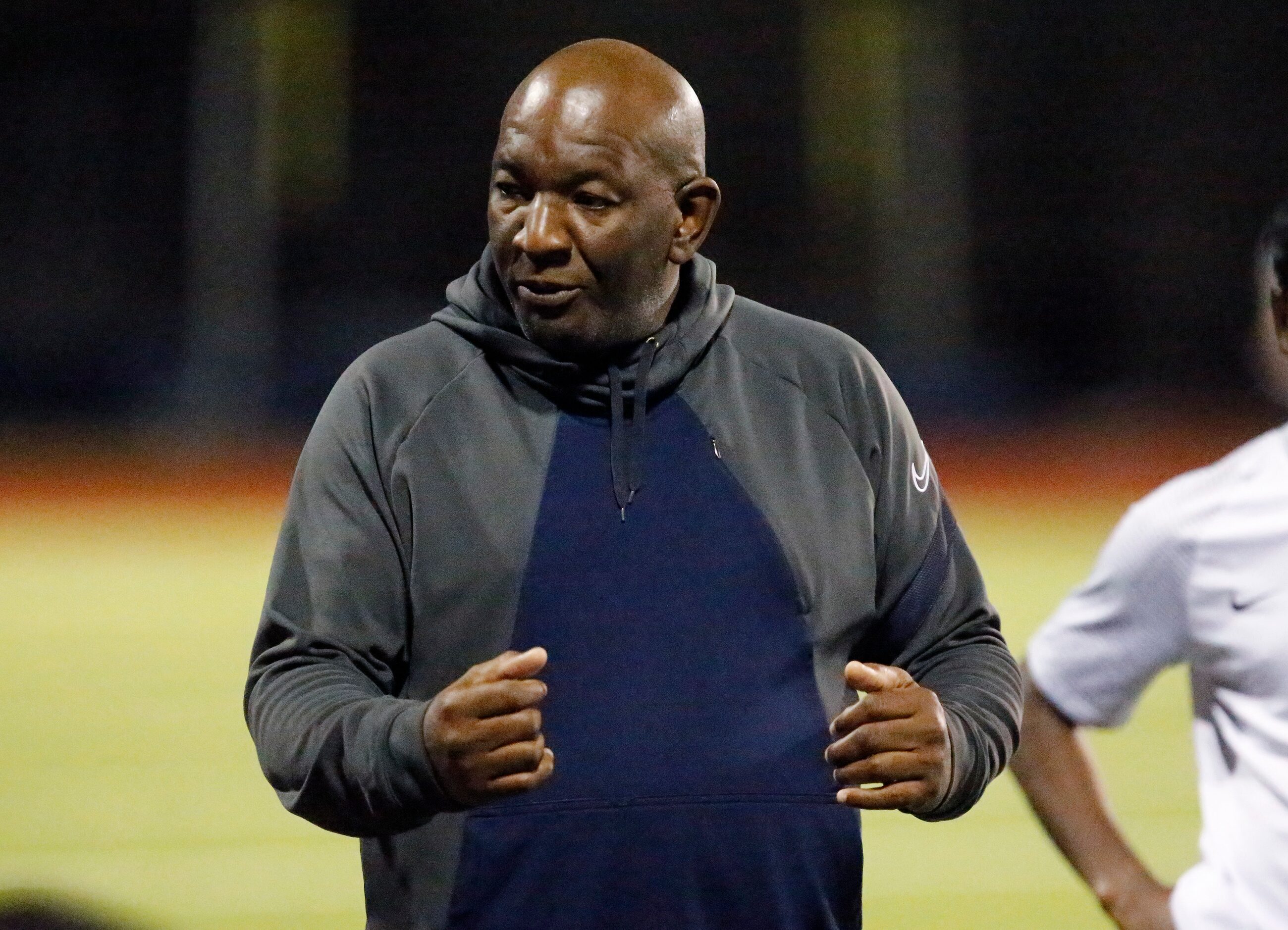 Allen High School head coach Kim Fullerton talks to his team at half time as McKinney Boyd...