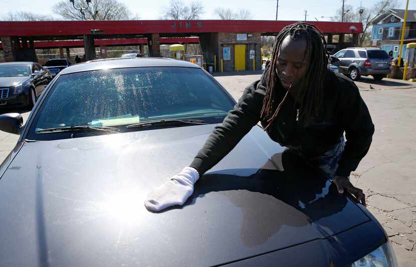 Tyrone Jackson dried his car after washing it at Jim's Car Wash off of Martin Luther King...