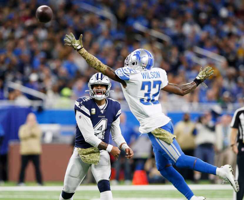 Dallas Cowboys quarterback Dak Prescott (4) attempts a pass as Detroit Lions strong safety...