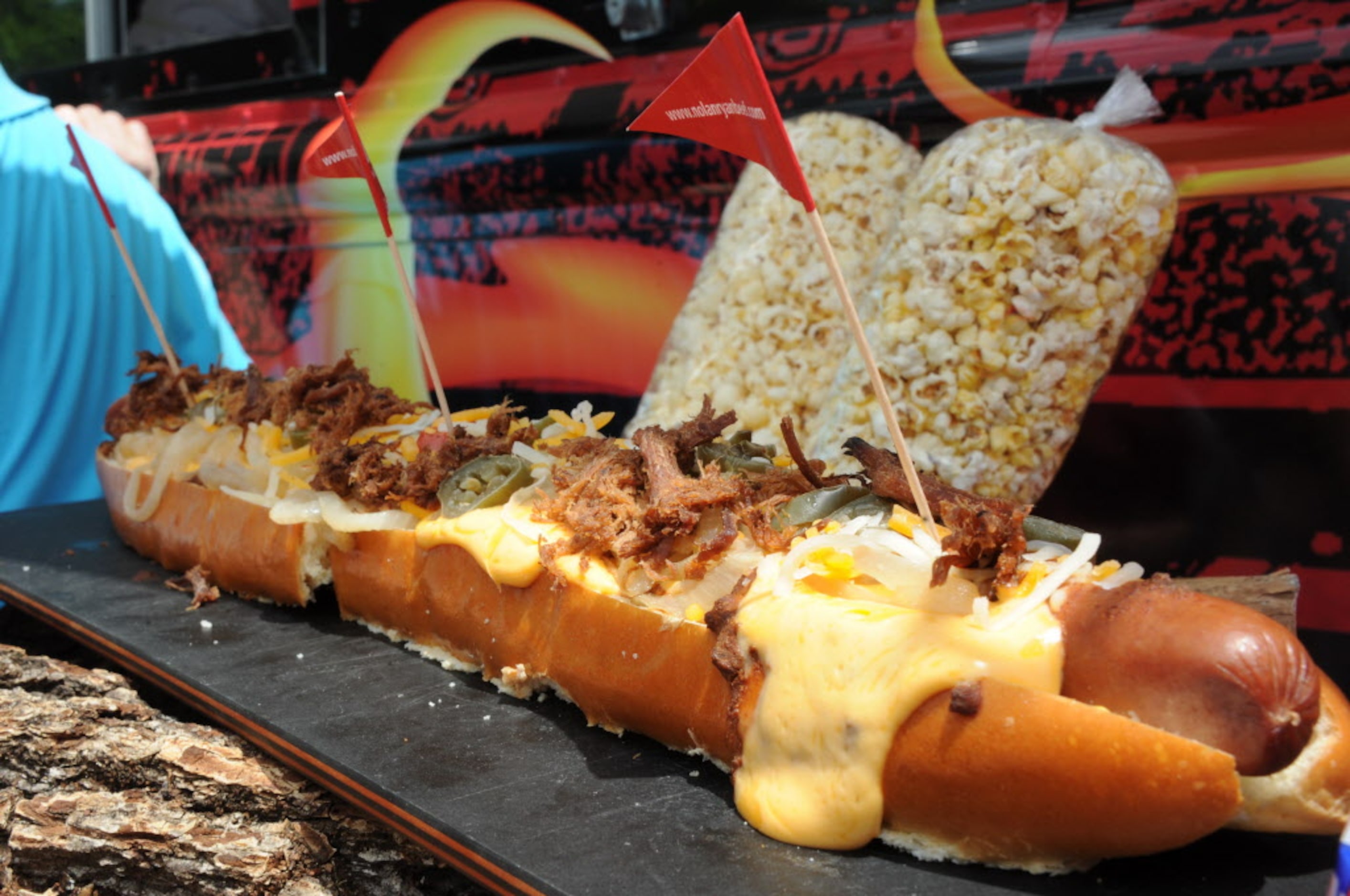 This $32.00 two-foot long fully loaded hot dog can be found at the Arlington Ball Park food...