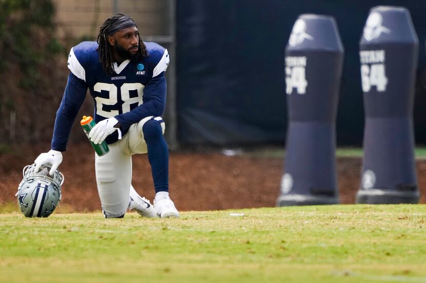 Dallas Cowboys safety Malik Hooker takes a break while doing conditioning during a practice...