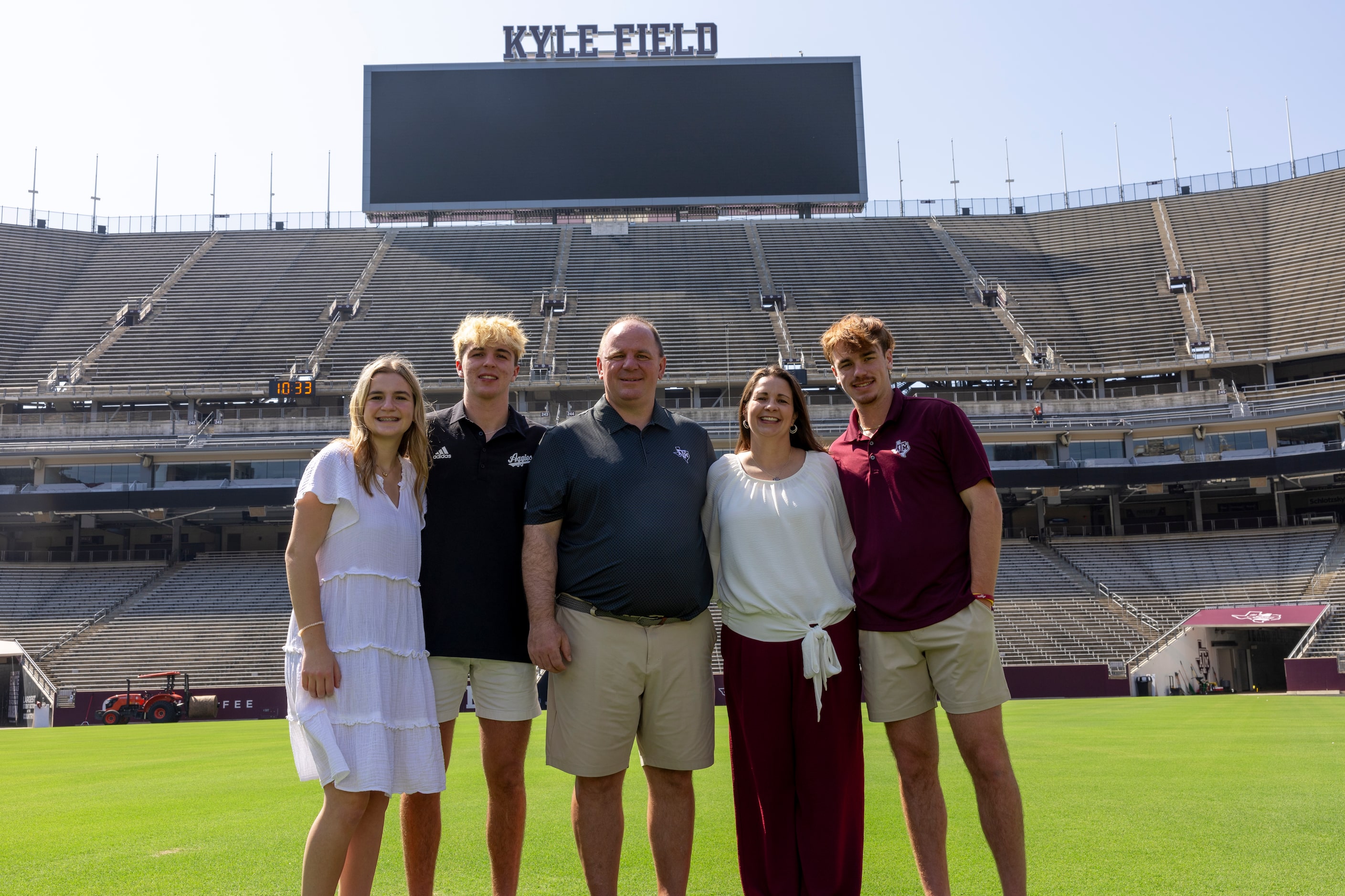 Texas A&M head coach Mike Elko poses for a family photo with his wife, Michelle, and their...