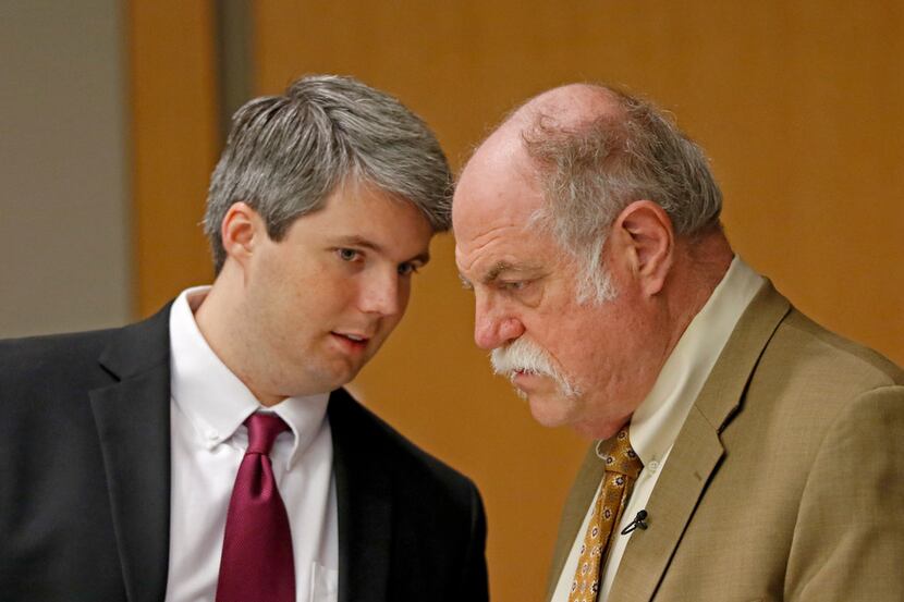 Defendant Jason Lowe (left) talks with his attorney Andrew Farkas during his murder trial in...