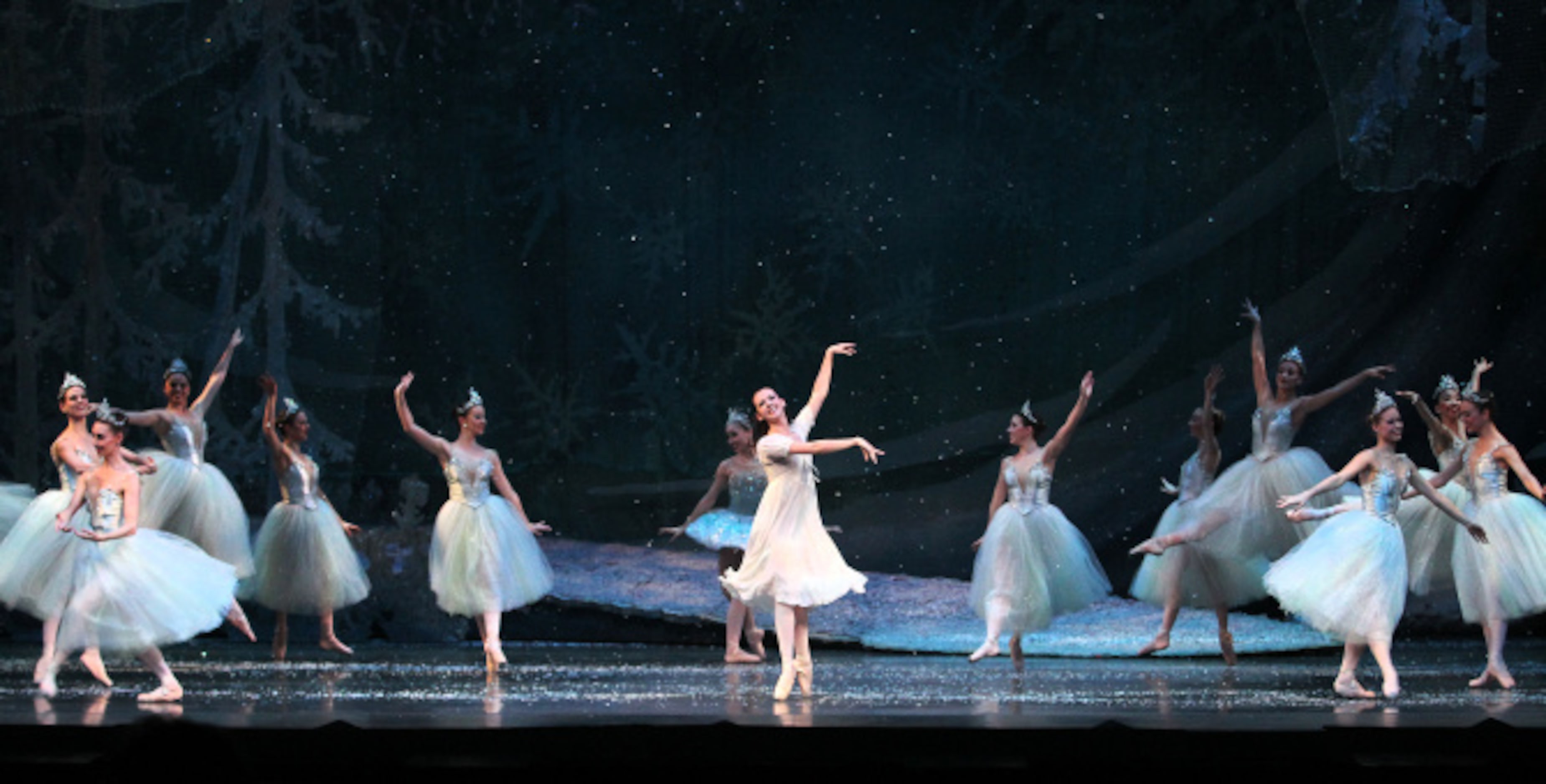 Clara played by Alexandra Farber dances with Snowflakes in Texas Ballet Theater's "The...