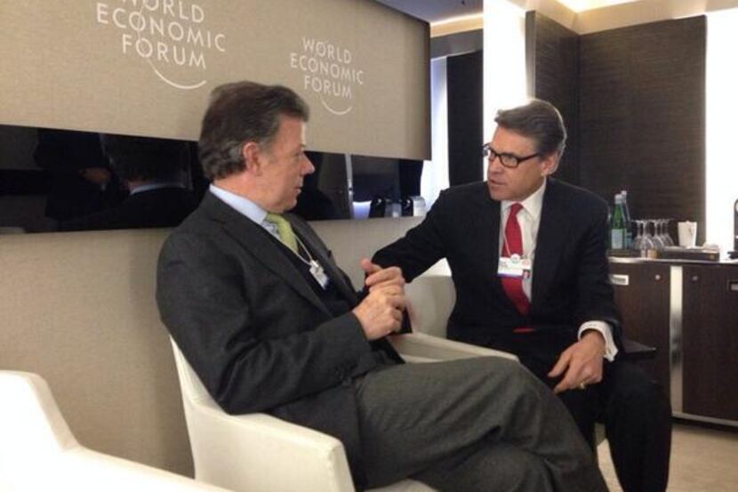 Rick Perry speaks with Colombian President Juan Manuel Santos at the World Economic Forum.