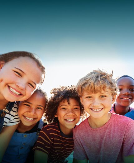 A group photo of smiling preteens.