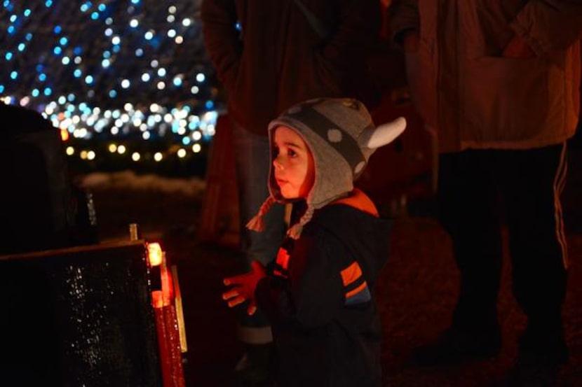 Sebastian Petrovski, 3, waits to get on the Holiday Express Riding Train.