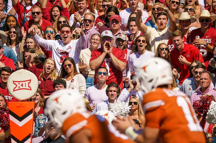 Oklahoma fans yell as Texas quarterback Sam Ehlinger (11) prepares to take a snap during the...