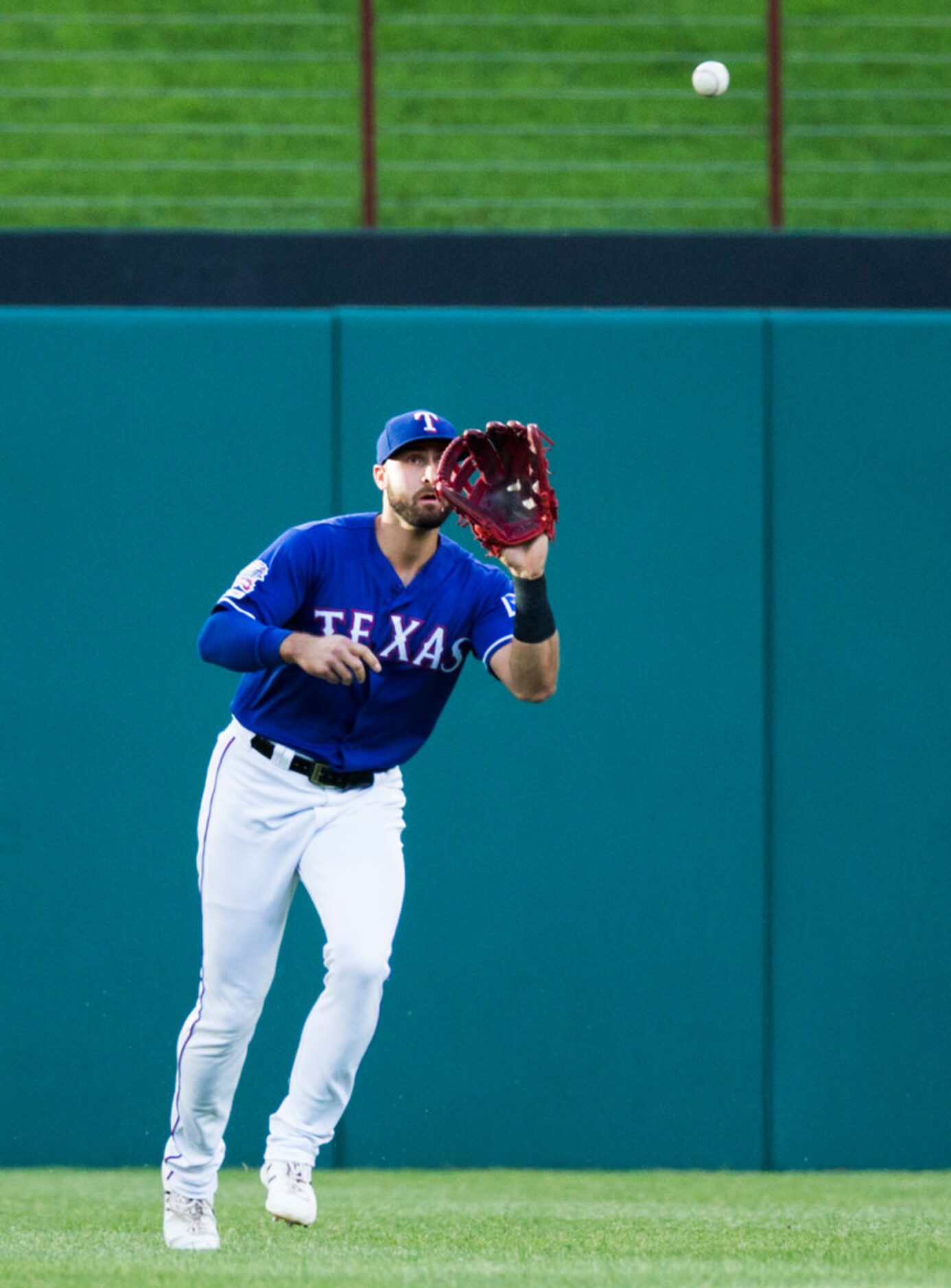 Texas Rangers center fielder Joey Gallo (13) catches a fly ball to the outfield hit by...