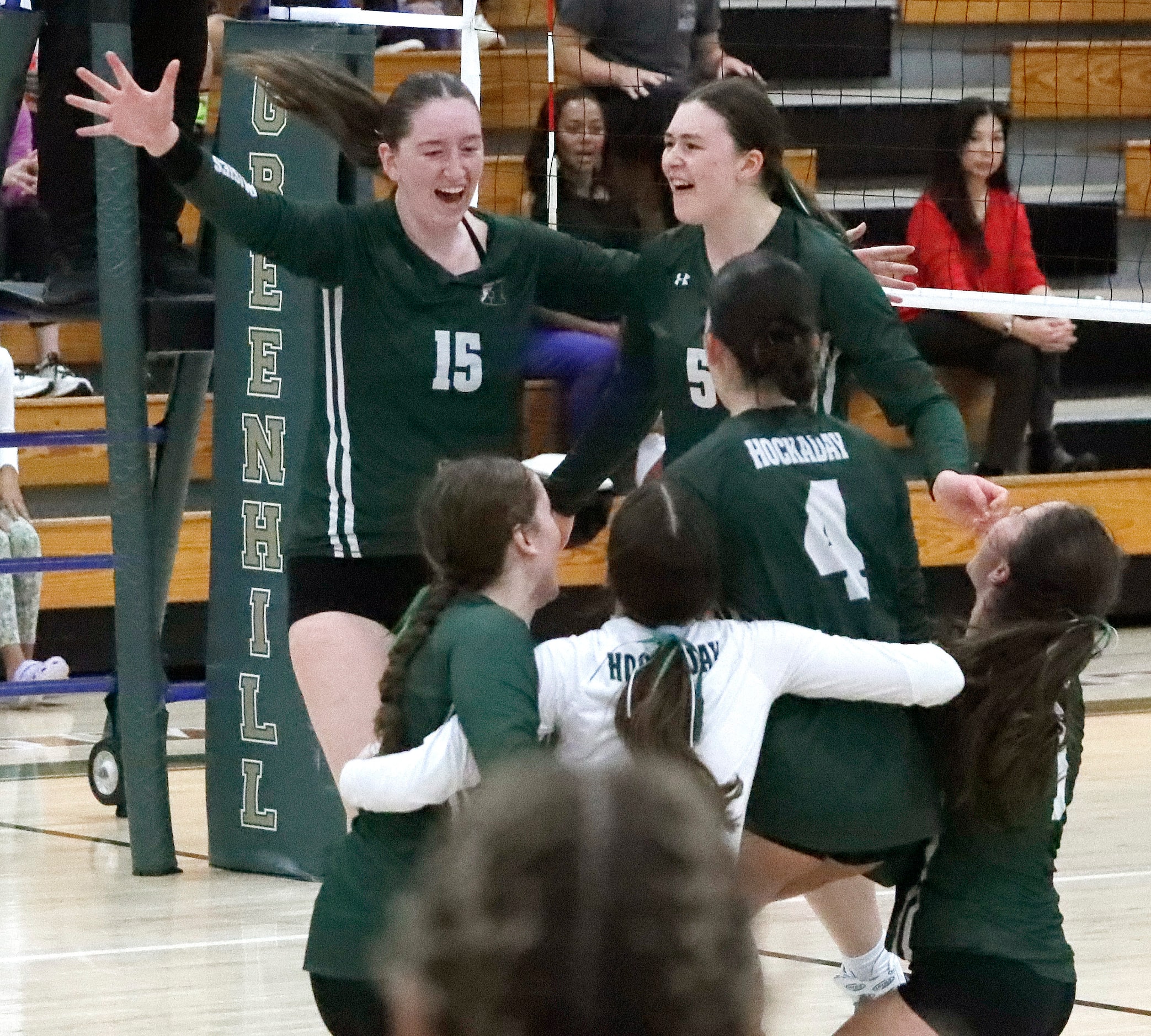 Hockaday's Olivia Wayne (15) goes to embrace Clara Gruner (5) after the team wins three...