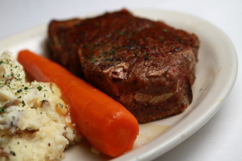 A 22-ounce Kansas City strip served with a signature carrot and mashed potatoes from Bob's...