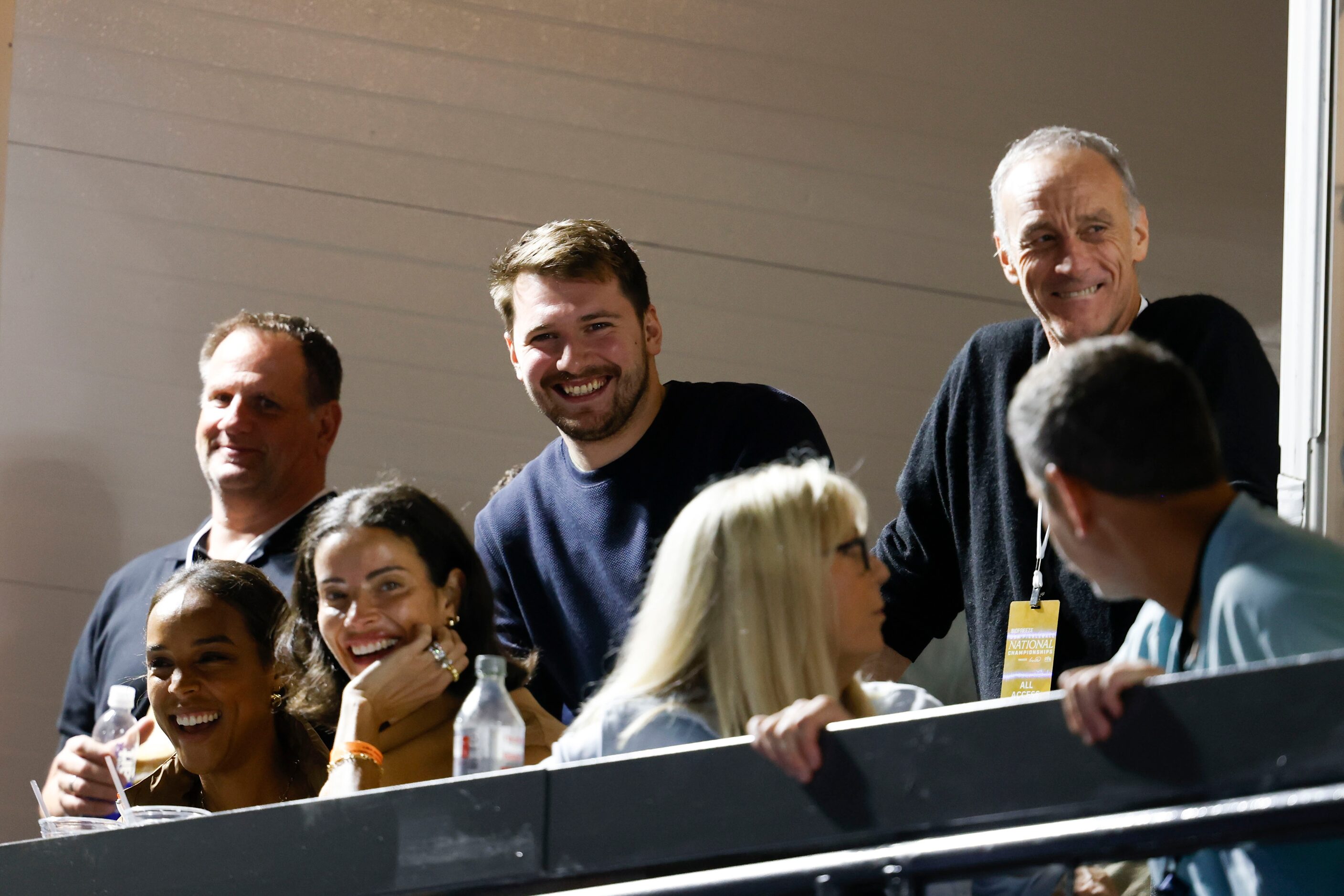 Dallas Maverick’s Luka Dončić (center) watch the Celebrity Pickleball Showdown on Tuesday,...