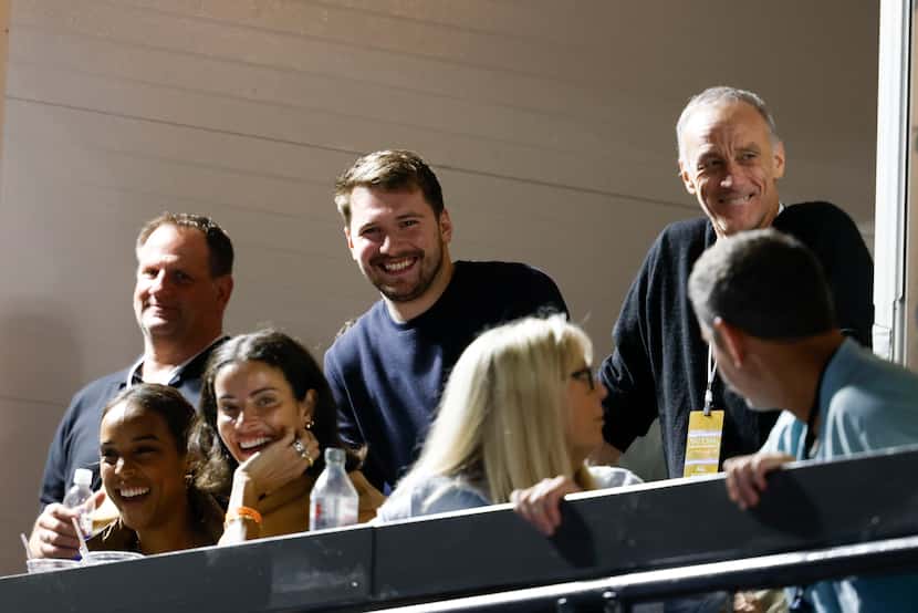 Dallas Mavericks star Luka Dončić (center) was in the crowd when his coach Jason Kidd and...