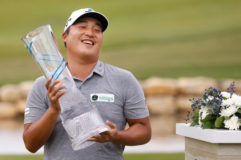 Kyoung-Hoon Lee lifts the trophy after winning the AT&T Byron Nelson at TPC Craig Ranch on...