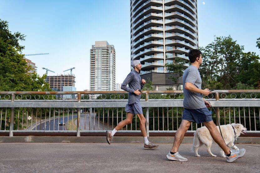 Runners make their way through the Katy Trail in Dallas, Texas on July 16, 2024. 