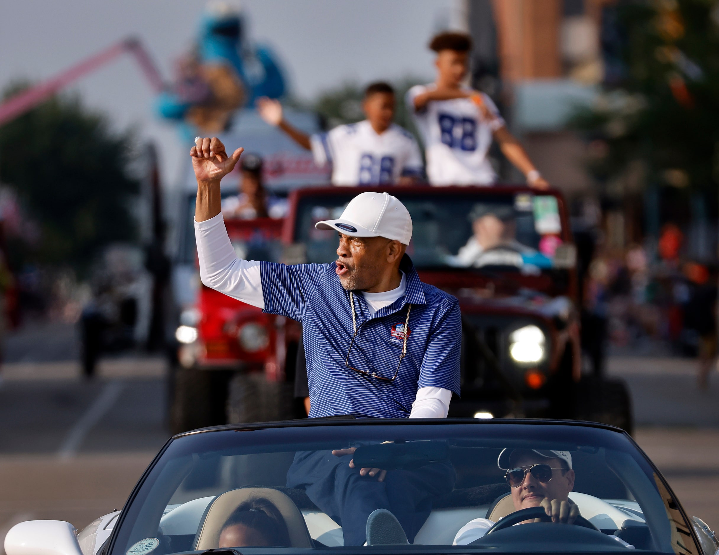 Dallas Cowboys Pro Football Hall of Fame inductee Drew Pearson fires up the fans along the...