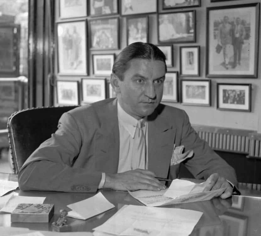 George Preston Marshall, owner of the Washington Redskins, at his desk in Washington in 1935.
