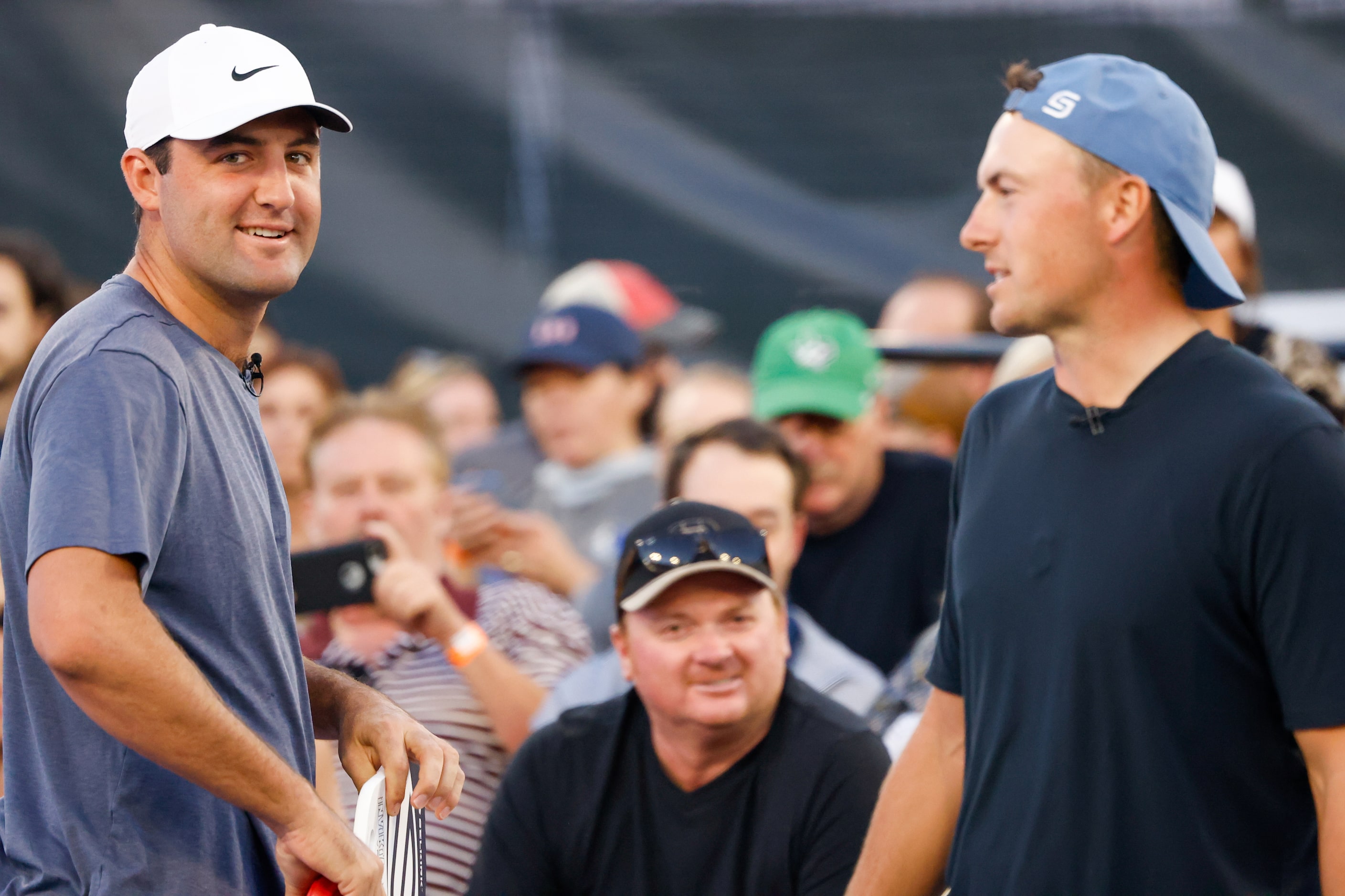 Scottie Scheffler (left) greets his doubles teammate Jordan Spieth (right) before a...