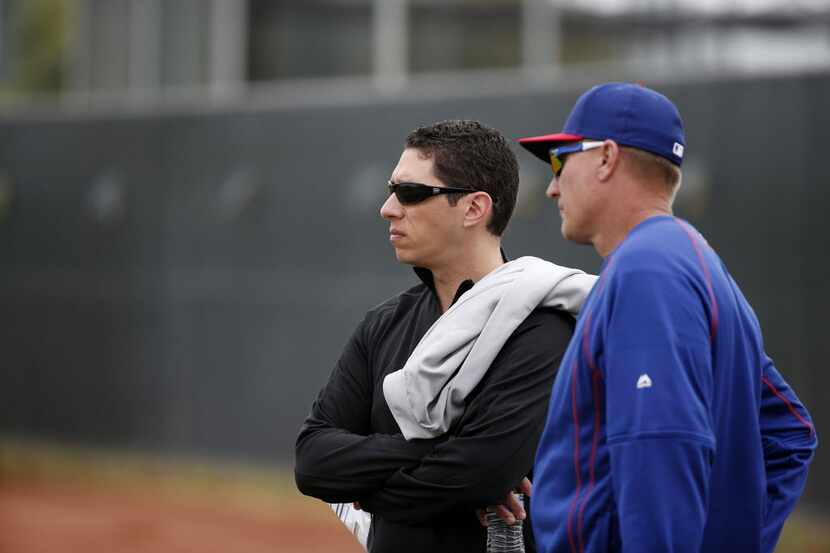 Texas Rangers general manager Jon Daniels (left) and manager Jeff Banister watch batting...