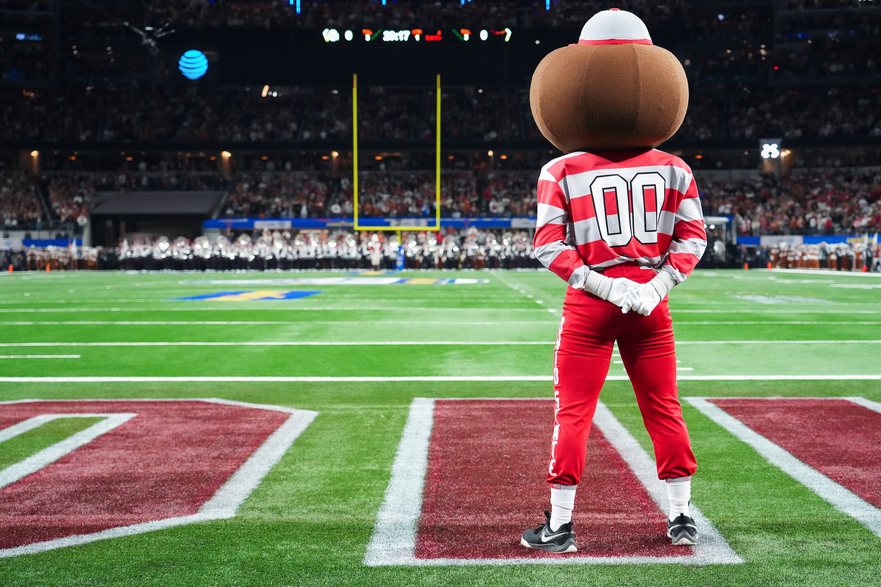 Ohio State mascot Brutus observes a moment of silence for victims of California fires before...