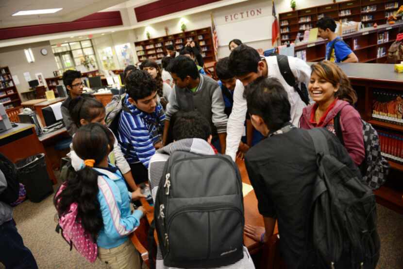 More than 40 Conrad High School students form Venturing Crew 9, using their diverse language...