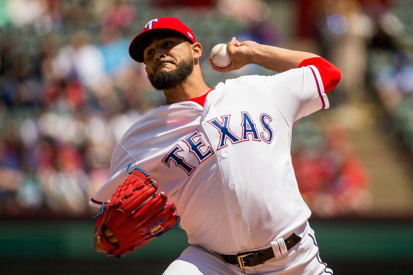 Texas Rangers starting pitcher Martin Perez pithces during the first inning against the...