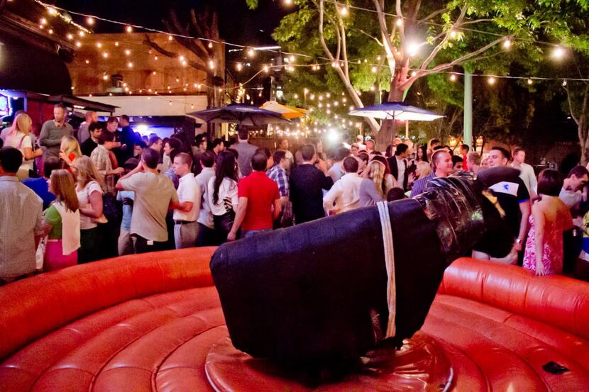  Uptown's Trophy Room often draws a crowd, particularly for its signature mechanical bull....
